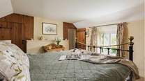 The en suite for the main bedroom (Bedroom 1) is through the door in the far corner.