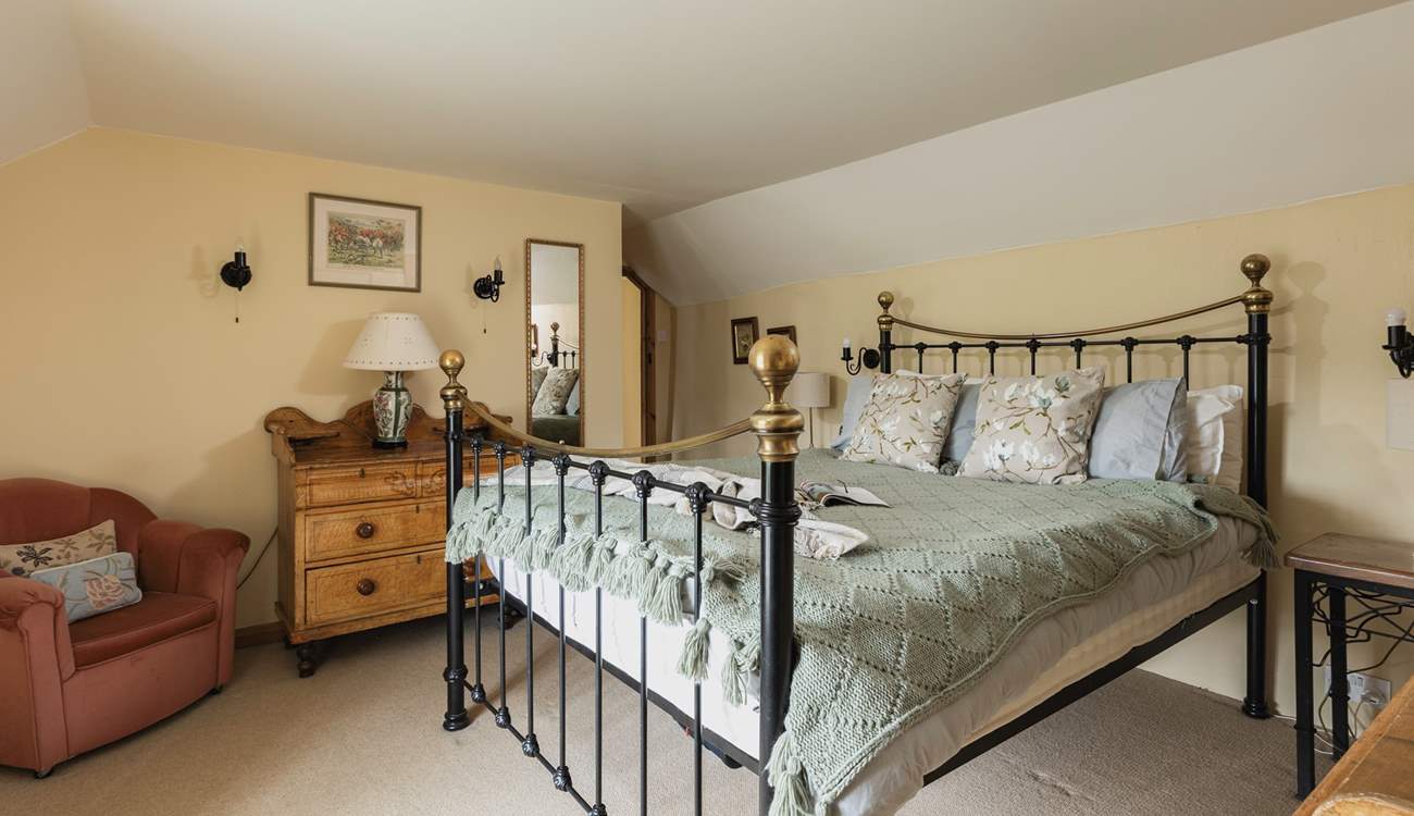 Bedroom 1, the main bedroom, is beautifully furnished.