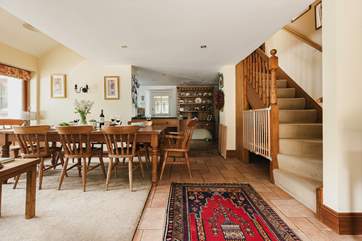 Stairs lead from the open plan living-area to the bedrooms and bathroom on the first floor.