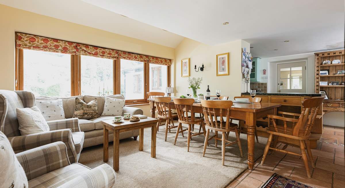 French windows lead from this room out to the patio and garden beyond. Parking is off-road here, just in front of this room.