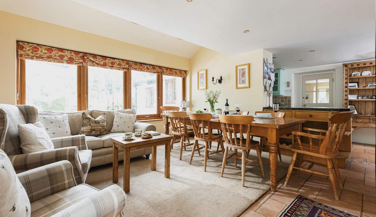 French windows lead from this room out to the patio and garden beyond. Parking is off-road here, just in front of this room.