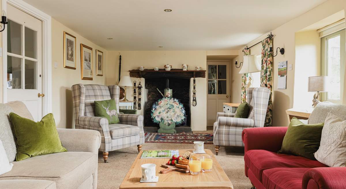 The utility-room and downstairs shower-room are through the door at the  far end of the sitting-room.