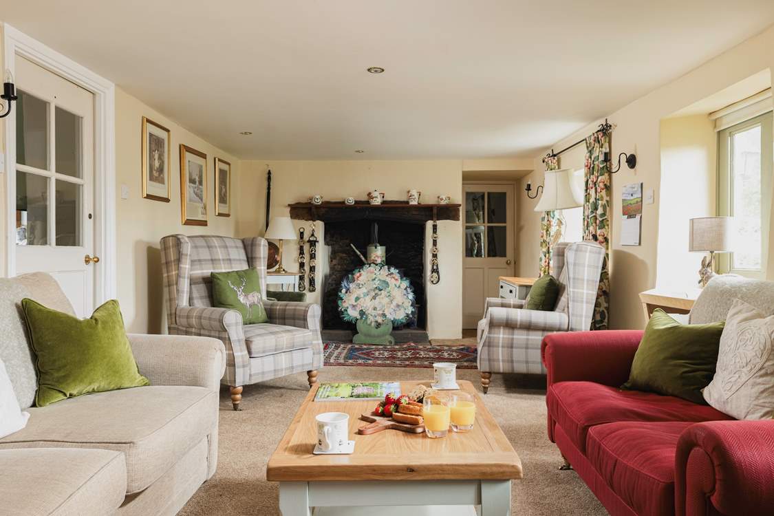 The utility-room and downstairs shower-room are through the door at the  far end of the sitting-room.