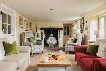 The utility-room and downstairs shower-room are through the door at the far end of the sitting-room.