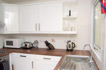 The modern bright white kitchen.