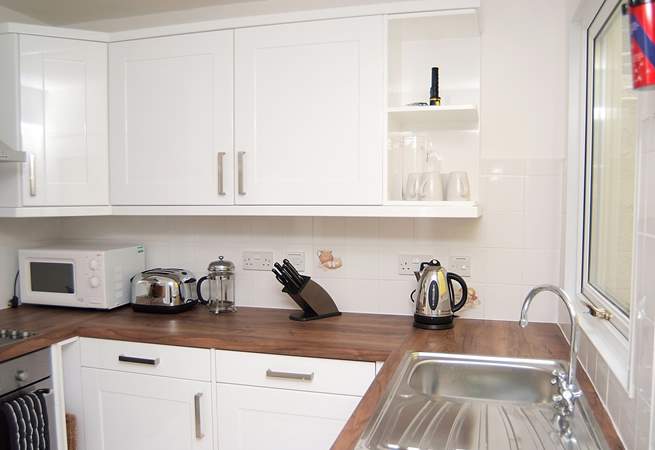 The modern bright white kitchen.