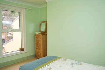 The single bedroom looks out over the rear garden.