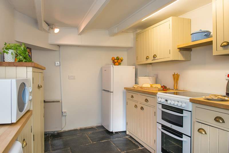 The cottage kitchen with lovely flagstone floor.