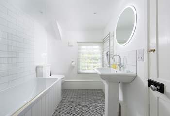 The cottage has a stylish bathroom with a bath.....