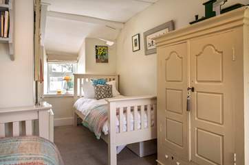 The twin bedroom is light and airy and has plenty of storage.