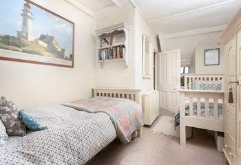 The twin bedroom is light and airy and has plenty of storage.