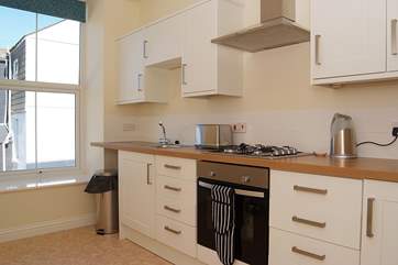 There is a lovely large window in the kitchen.