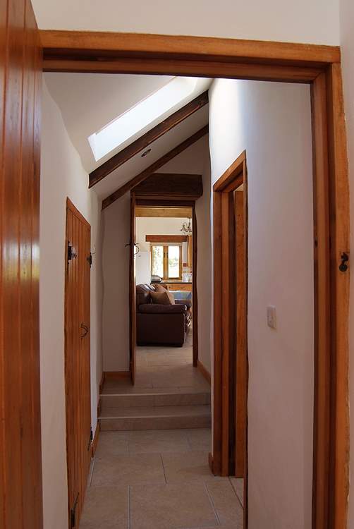 There are two steps from the living-room down to the bedrooms and bathroom.