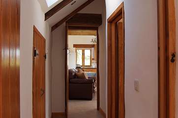 There are two steps from the living-room down to the bedrooms and bathroom.