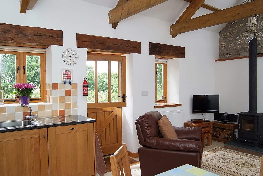 The living-room has a stable-door which opens onto the quiet drive, on the other side of which is the garden.