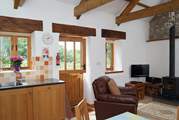 The living-room has a stable-door which opens onto the quiet drive, on the other side of which is the garden.