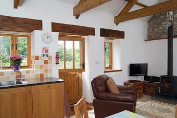 The living-room has a stable-door which opens onto the quiet drive, on the other side of which is the garden.
