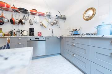 The kitchen is characterful and well-equipped.