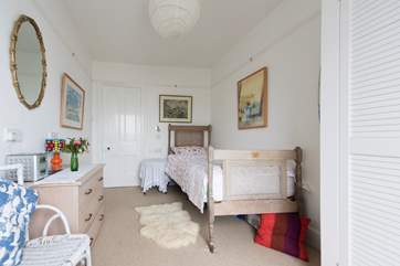 The pretty single bedroom has sea views.