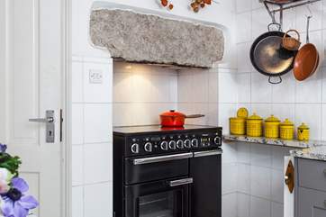 Quaint vintage crockery add to the charm of this pretty terraced cottage.