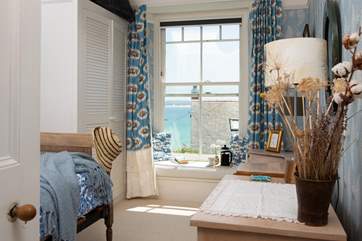 Sit on the window seat and watch the boats in the harbour.