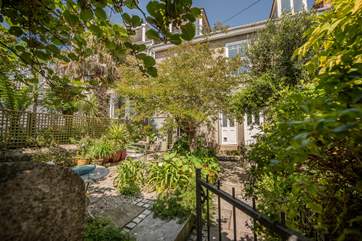 The garden is an oasis of peace and tranquility, perfect for morning coffee or an evening aperitif.
