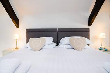 Lovely crisp white linen adorns the bed.