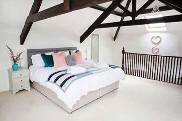 Lovely crisp white linen adorns the bed.