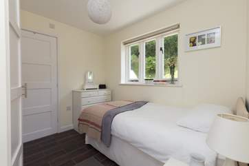Another view of the single bedroom, which also has plenty of storage space along one length of it.