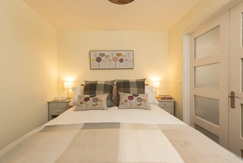 Another view of the main bedroom. You are sure to sleep soundly here. The cottage is in a truly peaceful setting.