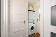 By the entrance door is your utility-area and to the left of it the cloakroom.