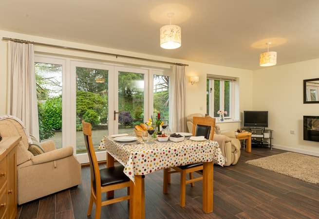 The bright and spacious open plan living space has French windows out onto your patio.