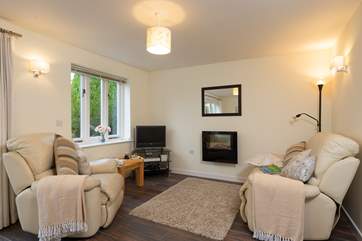 The cottage has a wonderfully comfortable recliner armchair and sofa.