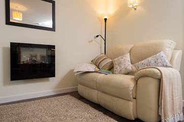 The log effect electric fire adds a cosy feel to an out-of-season break.
