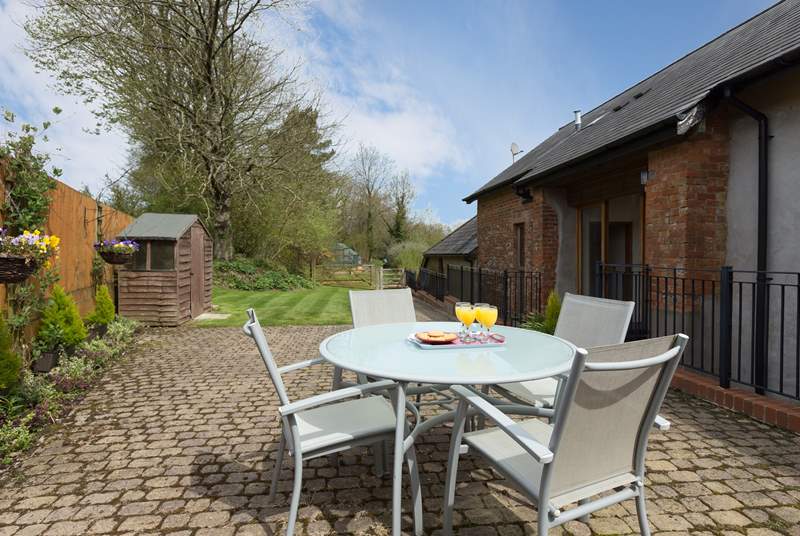 There is a very sunny and sheltered patio and lawned garden area behind the barn, with direct access into it on the level.