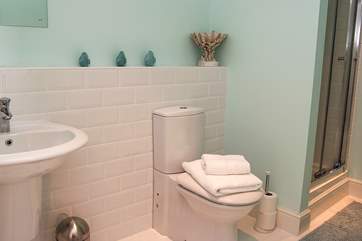 The family bathroom has a bath and shower cubicle.