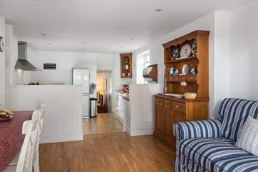 Two steps lead down from the dining area, into the kitchen.