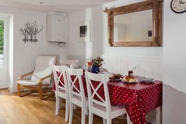 Get all the family together around this large dining table (there is a bench to perch on, which is tucked under the table opposite the chairs)