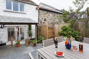 The terrace is the perfect spot for a glass of wine. Four steps lead up onto this pretty outside area.