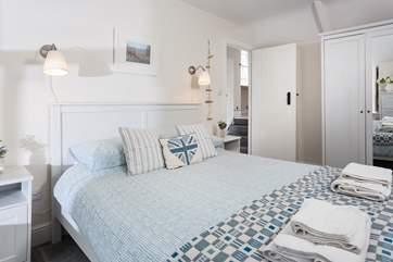 Pretty bedroom two. As you come out of the door you will find four steps which lead up to the family bathroom.