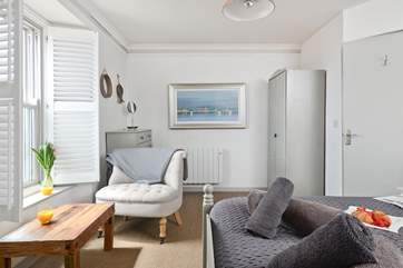 The master bedroom has a sitting-area from which to enjoy watching the ebb and flow of the tide.