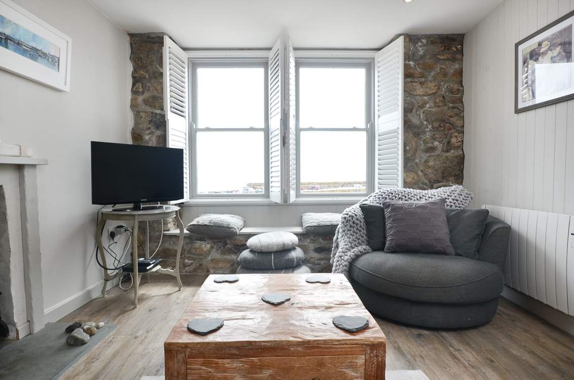 The sitting-room overlooks the harbour.