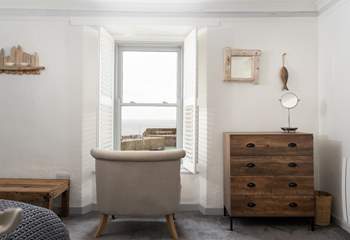 The main bedroom has a sitting-area from which to enjoy watching the ebb and flow of the tide.