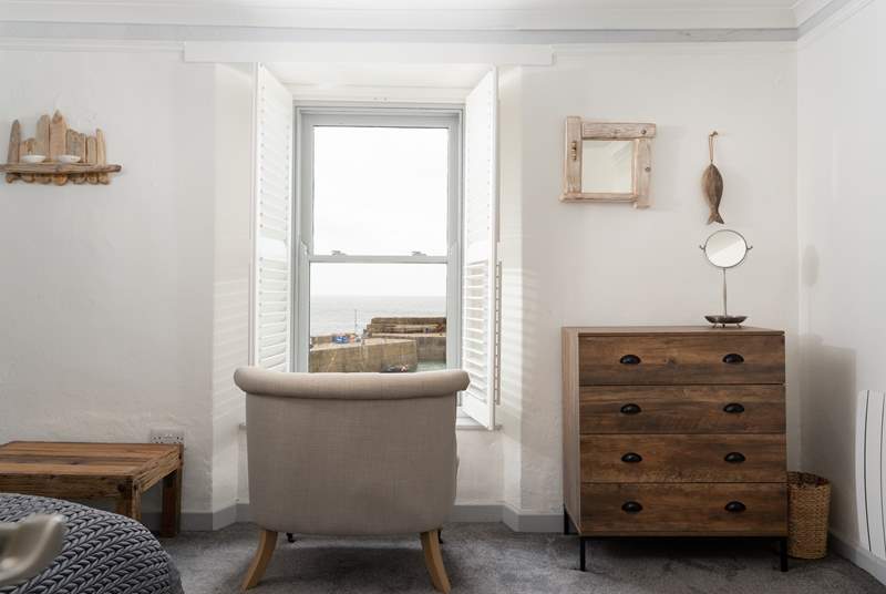 The main bedroom has a sitting-area from which to enjoy watching the ebb and flow of the tide.