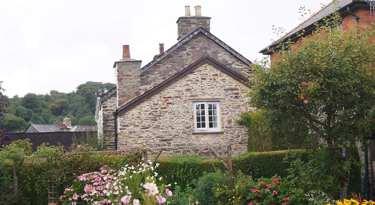 A view of this pretty end of terrace cottage, taken from the neighbouring gardens.