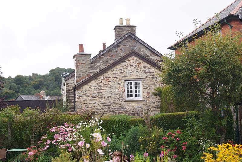 A view of this pretty end of terrace cottage, taken from the neighbouring gardens.