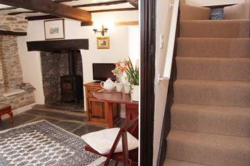 Steep cottage stairs lead to the bedroom and bathroom - please take care of the low lintel.