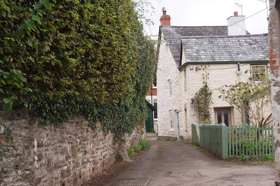 This is the entrance to Rosemary Lane. Lane Cottage is off a tiny square with private parking at the end of the lane.