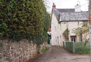 This is the entrance to Rosemary Lane. Lane Cottage is off a tiny square with private parking at the end of the lane.