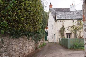 This is the entrance to Rosemary Lane. Lane Cottage is off a tiny square with private parking at the end of the lane.